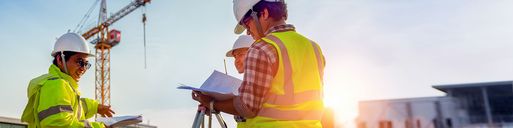 Construction engineers discussion with architects at construction site