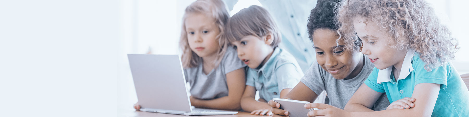 Children using laptop and smartphone